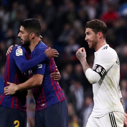 Barcelona's Lionel Messi, Luis Suarez and Gerard Pique celebrate victory as Real Madrid's Sergio Ramos walks off. Photo: Reuters