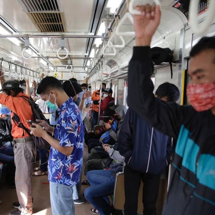 Passengers pictured on a commuter-line train in Bogor, Indonesia, on June 10. Photo: EPA