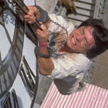 Jackie Chan in the scene from 1983 film Project A where he leaps from a 22-metre clock tower. He performed the stunt three times – twice successfully, which he used in the film as a double cut – and a third time unsuccessfully, bouncing onto the ground, which ran after the end credits. Both became signature practices in his films.