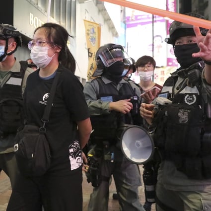 Police take away a woman arrested at a protest in Causeway Bay. Photo: Dickson Lee