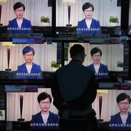 A man watches television sets broadcasting Hong Kong Chief Executive Carrie Lam making an announcement on the now-withdrawn extradition bill, at a home electronics retailer in Hong Kong on September 4, 2019. The controversial bill sparked the largest and most sustained series of protests that Hong Kong has seen since the 1997 handover. Photo: AP