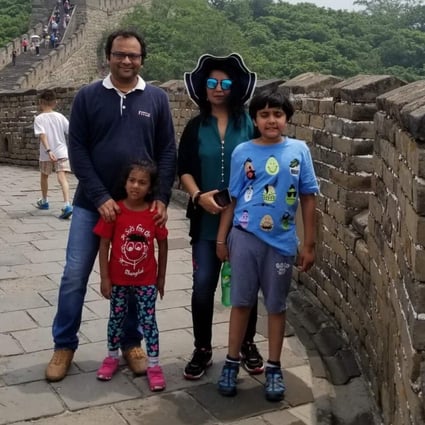 Indian national Vivek Gupta and his family at the Great Wall of China. Photo: Handout / Rajni George