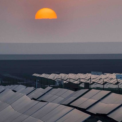 The sun sets over a photovoltaic power plant in Turpan in northwest China’s Xinjiang Uygur Autonomous Region in September 2018. China has been trying to ensure the solar power sector can survive without subsidies. Photo: Xinhua