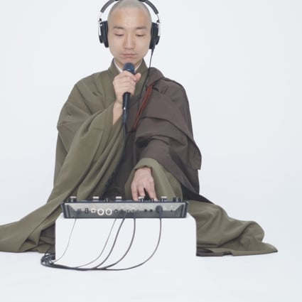 Beatboxing Buddhist monk Yogetsu Akasaka with his loop machine.