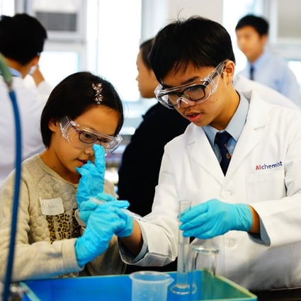Children conduct a science experiment as part of an event at a secondary school in Ho Man Tin in December 2014. Photo: SKH Tsoi Kung Po Secondary School
