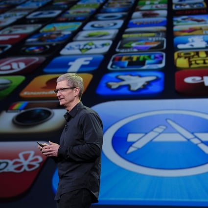 Apple chief executive Tim Cook said the company’s App Store, represented by the large icon in the background, “provides enduring opportunities for entrepreneurship, health and well-being, education, and job creation” in a challenging time. Photo: Xinhua