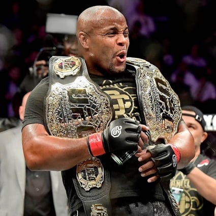 Daniel Cormier celebrates his victory over Derrick Lewis in their heavyweight title bout at UFC 230. Photo: AFP