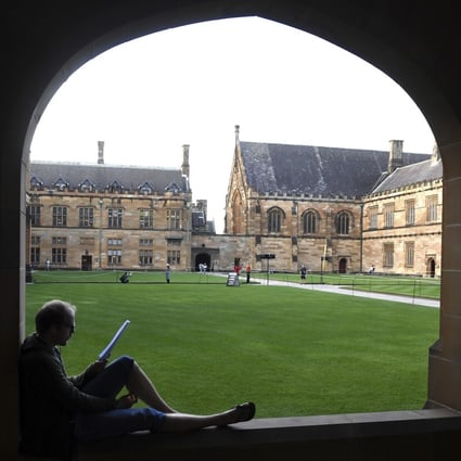 A student reads at the Quadrangle of the University of Sydney. File photo: AAP Image via AP