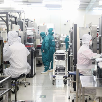 Technicians work at a semiconductor wafer fab in Shanghai, Feb. 10, 2020. Photo: Xinhua