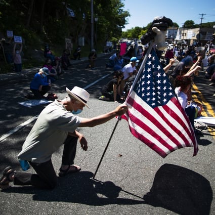 Demonstrators kneel during a solidarity protest for George Floyd on June 13 in West Point, New York. Photo: AP