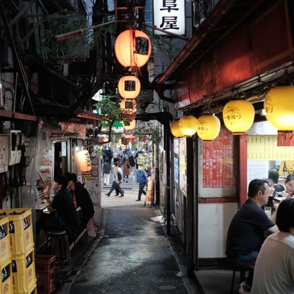 People dine at the Omoide-Yokocho alleyway in the Shinjuku district of Tokyo, Japan. Photo: Bloomberg