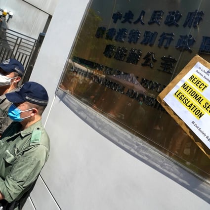 A petition letter stuck to the central government’s liaison office in Sai Ying Pun, as members of Amnesty International Hong Kong protest against the National Security Law. Photo: Felix Wong
