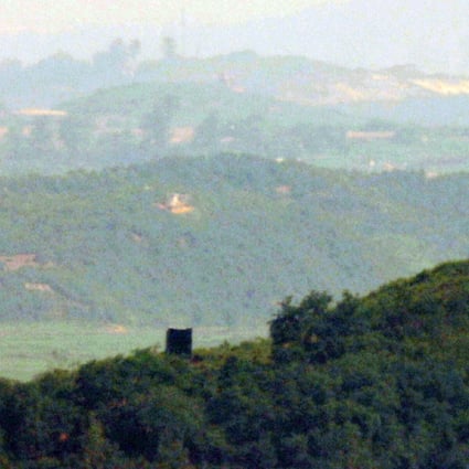 A propaganda loudspeaker (left) is seen near a North Korean guard post (right) inside the demilitarised zone, in this photo taken from the South Korean border city of Paju on June 23. Pyongyang began to reinstall loudspeakers on June 21, two years after the two Koreas removed their loudspeakers from the DMZ in adherence to the 2018 Panmunjom declaration. Photo: EPA-EFE / Yonhap