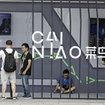 Employees and visitors at the Cainiao display at the Alibaba Group headquarters in Hangzhou, China. Photo: Bloomberg