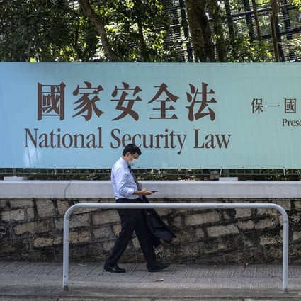 A government-sponsored banner urges support for the national security law for Hong Kong, near Central on June 19. Photo: Bloomberg