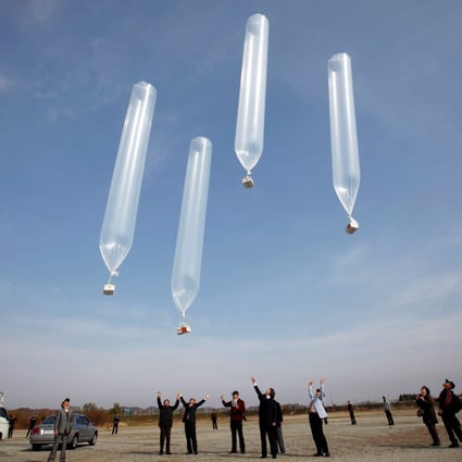 Members of an anti-North Korea civic group release balloons containing leaflets denouncing North Korean leader Kim Jong-un in October 2012, near the demilitarised zone separating the two Koreas. This week, a group of defectors tried to do the same ahead of the 70th anniversary of the Korean war. Photo: Reuters