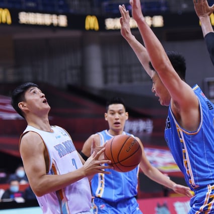 Action from the Chinese Basketball Association game between the Beijing Ducks and Xinjiang Flying Tigers. Photo: Xinhua