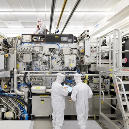 Employees work on the final assembly of a lithography machine at ASML in Veldhoven, Netherlands. In the advanced extreme ultraviolet (EUV) segment, ASML is the only viable player. Photo: Reuters