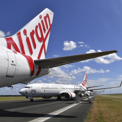 Grounded Virgin Australia aircraft are parked at Brisbane Airport on April 7, 2020. Australia's second-largest airline announced on April 21 that it had entered voluntary administration. Photo: AP