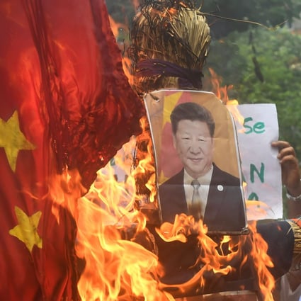 Indian protesters burn an effigy of Chinese President Xi Jinping in Kolkata. Photo: AFP