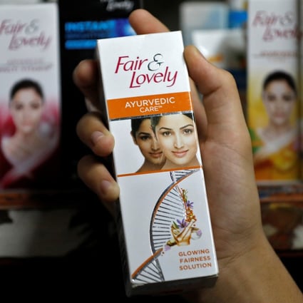 A customer picks up a “Fair & Lovely” skin-lightening cream from a shelf in a shop in Ahmedabad, India. Photo: Reuters