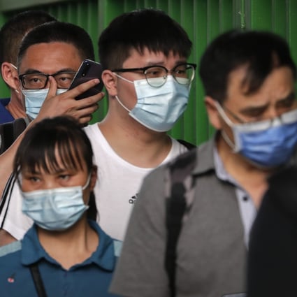 Commuters wearing face masks to help curb the spread of Covid-19 in Beijing, China. Photo: AP