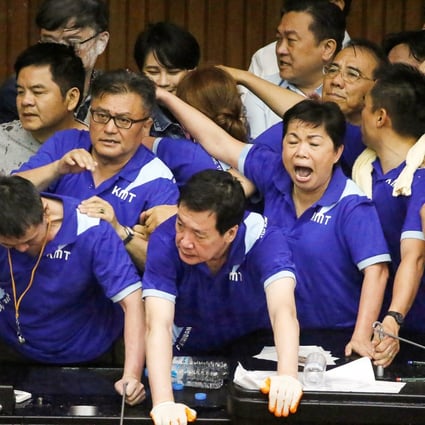 Lawmakers from Taiwan’s ruling Democratic Progressive Party scuffle with lawmakers from the main opposition Kuomintang party, who have been occupying the Legislature Yuan, in Taipei, Taiwan, on Monday. Photo: Reuters
