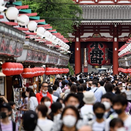 People in face masks visit Sensoji temple in Tokyo on June 28, 2020. The coronavirus outbreak has pushed japan’s economy towards recession. Photo: AFP
