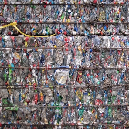 A block of compressed bottles at a plastic waste centre on the outskirts of Beijing in May 2018. China has passed legislation reaffirming its intent to completely ban solid waste imports. Photo: AFP