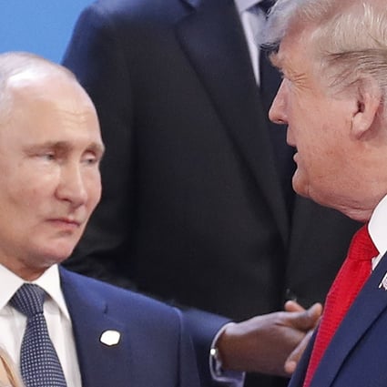 US President Donald Trump (right) and Russia's President Vladimir Putin get ready for a group photo at the start of the G20 summit in Buenos Aires, Argentina in November 2018. Photo: AP