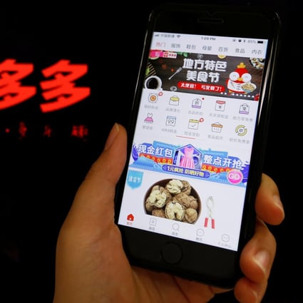 The logo of Chinese online group discounter Pinduoduo is seen next to its smartphone app. Photo: Reuters