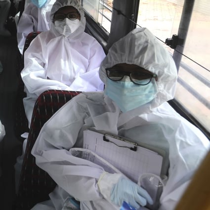 Health workers in India travel on a bus to conduct a free medical checkups in Mumbai. Coronavirus cases are surging in India, with over 600,000 infections. Photo: AP