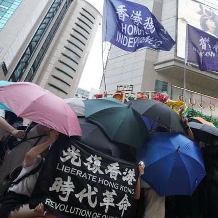 Anti-government protesters wave Hong Kong independence flags in Causeway Bay on Wednesday. Photo: Winson Wong