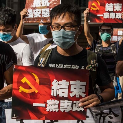 Pro-democracy protesters march during a rally against a new national security law in Hong Kong on Wednesday. Photo: AFP