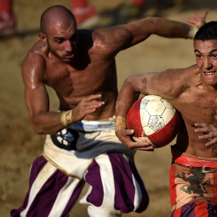 Players compete during the final of the annual calcio storico series in Florence, Italy. Photo: AFP