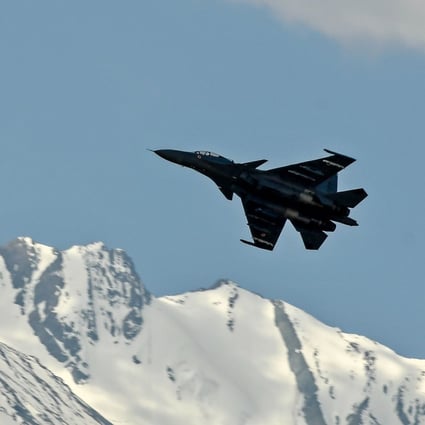 An Indian Air Force fighter flying in the mountain range surrounding Leh, near the border with China. Photo: AFP