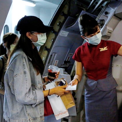 Would-be tourists take part in a “fake” travel experience for tourists at Songshan airport in Taipei on Thursday. Photo: Reuters