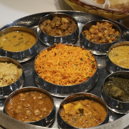 A thali from Woodlands Indian Vegetarian Restaurant in Tsim Sha Tsui, Hong Kong. A bowl of basmati rice is served with a variety of curries and other dishes. Photo: Edmond So