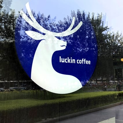 The logo of Chinese coffee chain Luckin Coffee is pictured on the window of one of its shop in Beijing. Photo: Simon Song