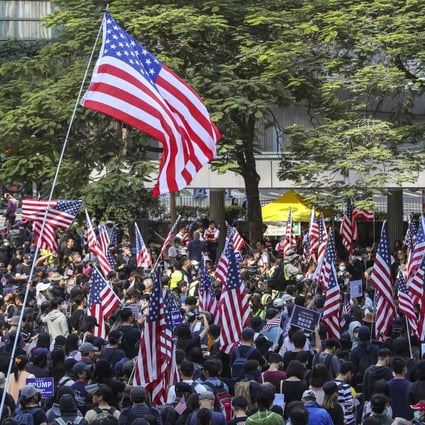 Anti-government protesters hold US flags during a Hong Kong rally last year. Photo: Winson Wong