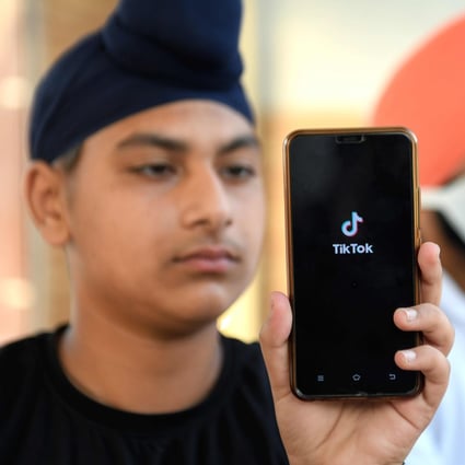India has banned Chinese-owned video-sharing app TikTok, and mobile phones could be targeted next. Photo: AFP