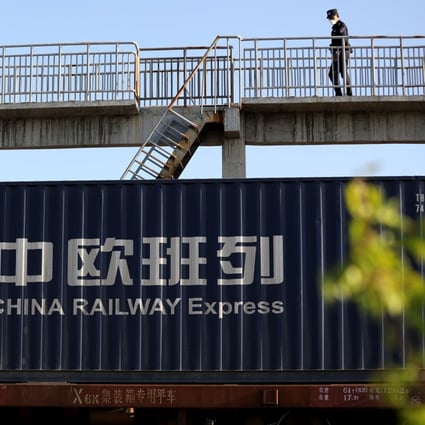 A police officer checks an outbound China-Europe freight train at Khorgos Pass in northwest China's Xinjiang Uygur Autonomous Region. Photo: Xinhua