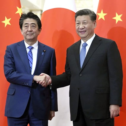 Japan's Prime Minister Shinzo Abe (left) and China's President Xi Jinping at their last meeting in December. Photo: AP