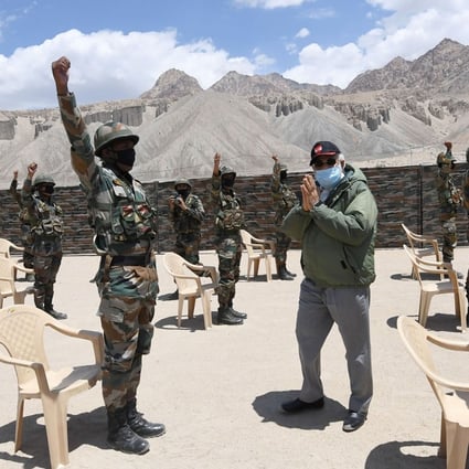 Indian Prime Minister Narendra Modi greets soldiers during a visit to the Ladakh region. Photo: AP