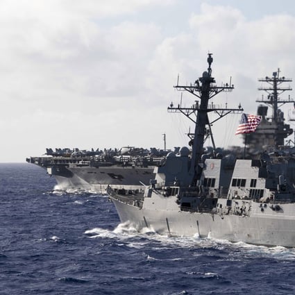 The guided-missile destroyer USS Ralph Johnson in formation with the aircraft carrier USS Nimitz during dual carrier operations with the Nimitz and Theodore Roosevelt Carrier Strike Groups on June 23. Photo: US Navy