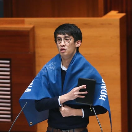 Sixtus Baggio Leung is draped in a banner that read ‘Hong Kong is not China’ during his oath-taking ceremony at Legco. He was subsequently stripped of his seat.Photo: Dickson Lee