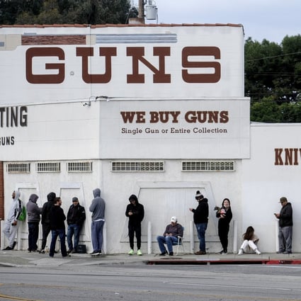 Americans wait in queue to enter a gun store amid the Covid-19 pandemic in Culver City, California, on March 15. Photo: AP