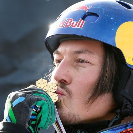 Australia’s Alex Pullin kisses his medal after the men’s snowboard-Cross finals at the 2013 FIS Snowboard World Championships in Stoneham, Quebec. Photo: Reuters