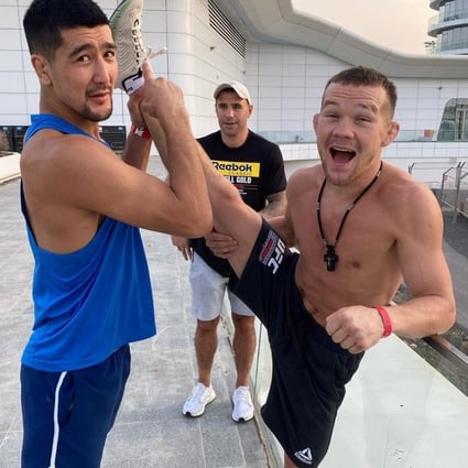 Petr Yan (right) with his coach John Hutchinson in Abu Dhabi ahead of UFC 251. Photo: @johnboyboxing