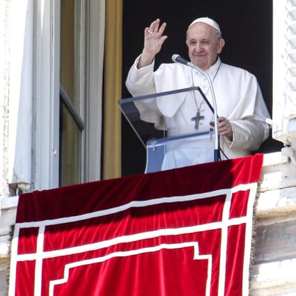 Pope Francis waves from his window overlooking St Peter's Square at the end of the Angelus prayer on Sunday. Photo: AP
